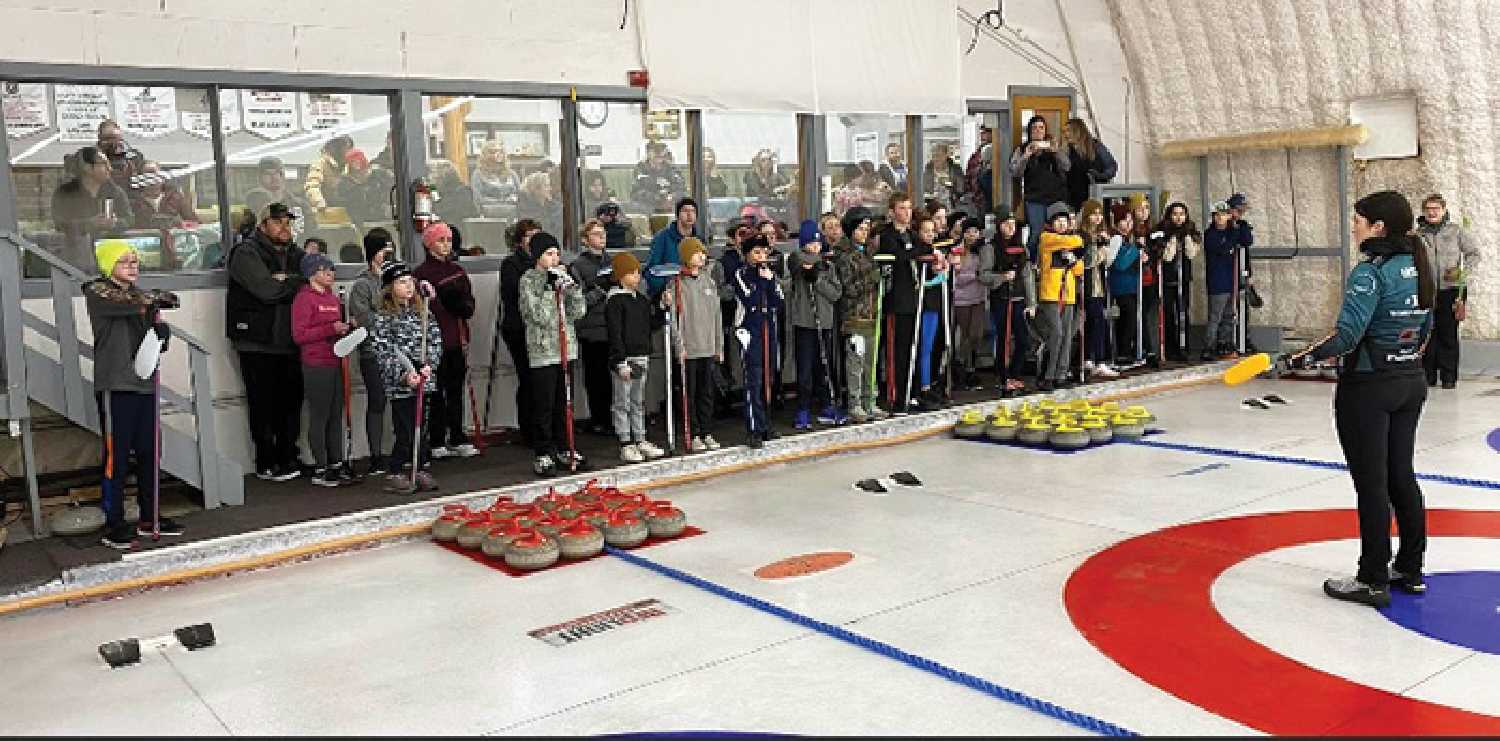 Rachel Erickson conducting a curling clinic in Maryfield on January 15.
